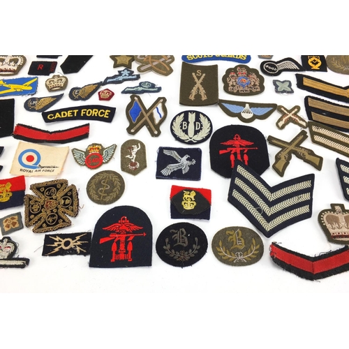 315 - British Military and other cloth insignia and together with a Civil Defence Corps arm band