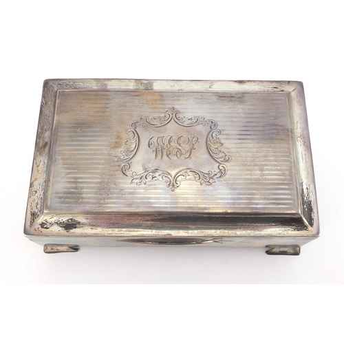 759 - Rectangular silver cigarette box, the hinged lid with engine turned decoration, J.C. Ltd Birmingham ... 