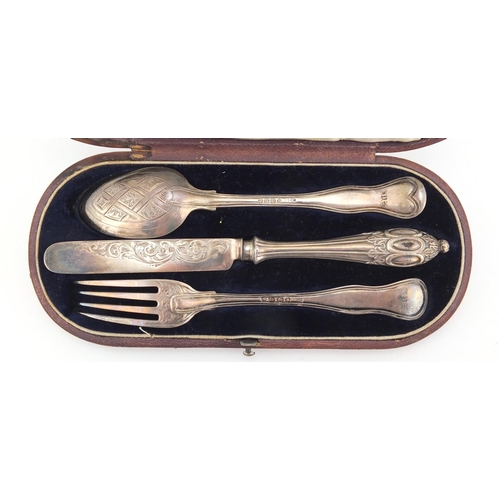 784 - Victorian silver knife, fork and spoon Christening set, with fitted tooled leather case, indistinct ... 