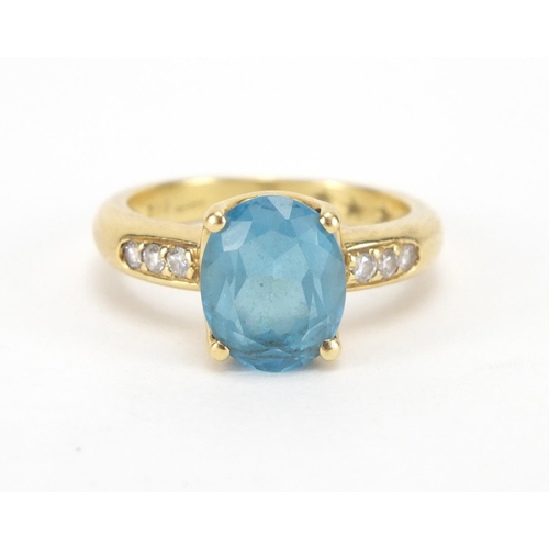 855 - 18ct gold topaz ring set with diamonds to the shoulders, size M, approximate weight 5.8g