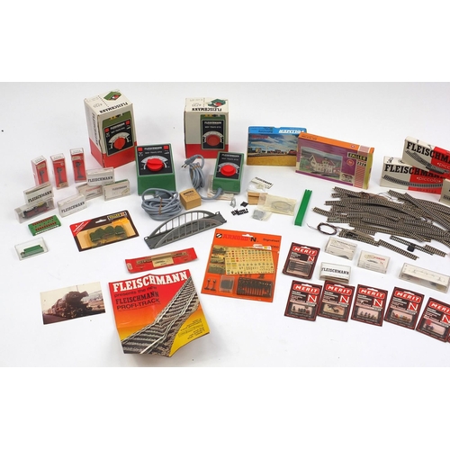 394 - Fleischmann N gauge model railway and accessories including tenders, advertising wagons and track