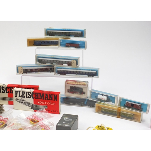 394 - Fleischmann N gauge model railway and accessories including tenders, advertising wagons and track