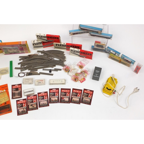 394 - Fleischmann N gauge model railway and accessories including tenders, advertising wagons and track