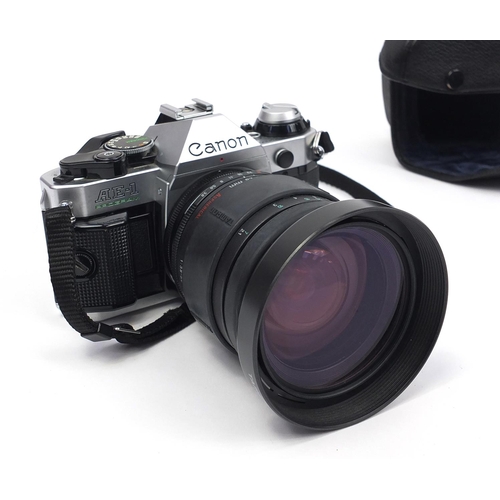 72 - Cameras, lenses and accessories comprising Canon AE-1 body with Tamron aspherical 28-200mm lense, Ni... 