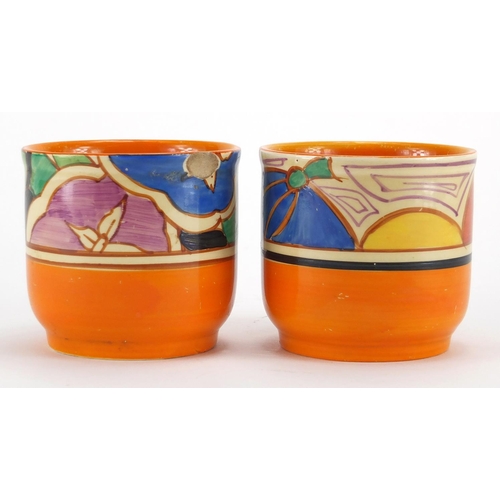 645 - Clarice Cliff Melon beaker hand painted with fruit together with a Gardenia beaker, retailed by Lawl... 