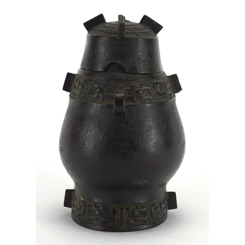 468 - Antique Chinese archaic bronze wine vessel having a stylised bands, with remnants of red paint, 19.5... 