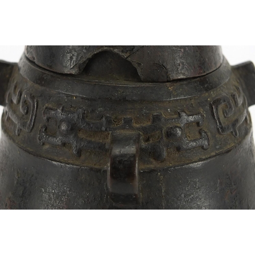 468 - Antique Chinese archaic bronze wine vessel having a stylised bands, with remnants of red paint, 19.5... 