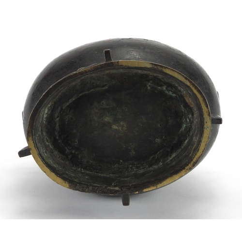 468 - Antique Chinese archaic bronze wine vessel having a stylised bands, with remnants of red paint, 19.5... 