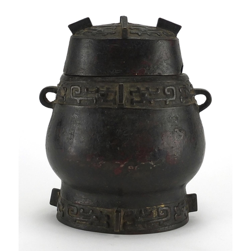 468 - Antique Chinese archaic bronze wine vessel having a stylised bands, with remnants of red paint, 19.5... 