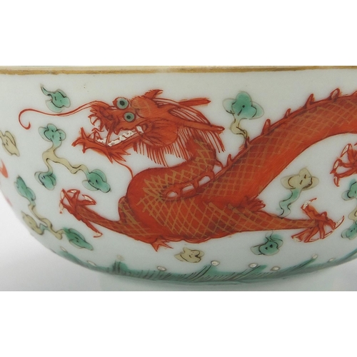 425 - Chinese porcelain bowl, hand painted in iron red with dragons amongst clouds chasing the flaming pea... 