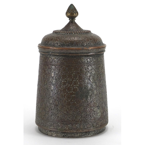 552 - Arabic copper pot and cover decorated with stylised flower heads, 17.5cm high