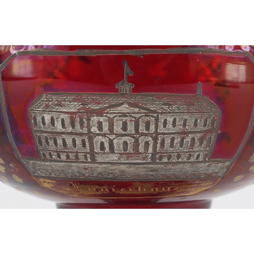 621 - 19th century Bohemian ruby red glass tazza, silvered and gilded with panels of buildings, 13.5cm hig... 