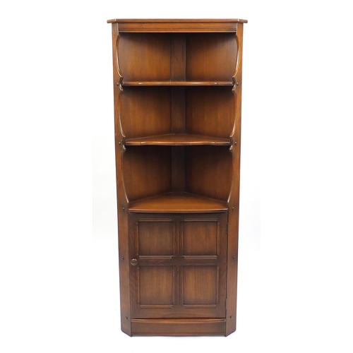 38 - Ercol stained elm standing corner cabinet, 184cm high