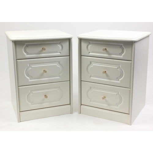 32 - Pair of white three drawer nightstands with glass handles, 70cm high x 51cm wide