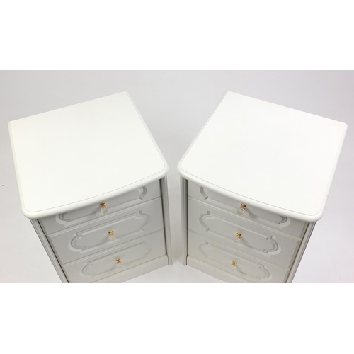 32 - Pair of white three drawer nightstands with glass handles, 70cm high x 51cm wide