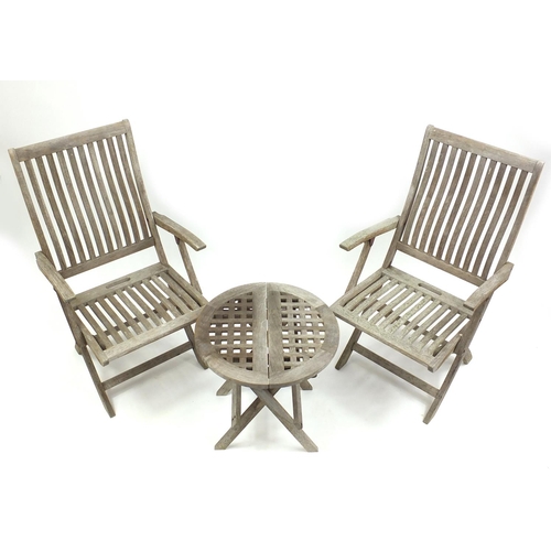 84 - Pair of folding teak garden chairs and a folding garden table