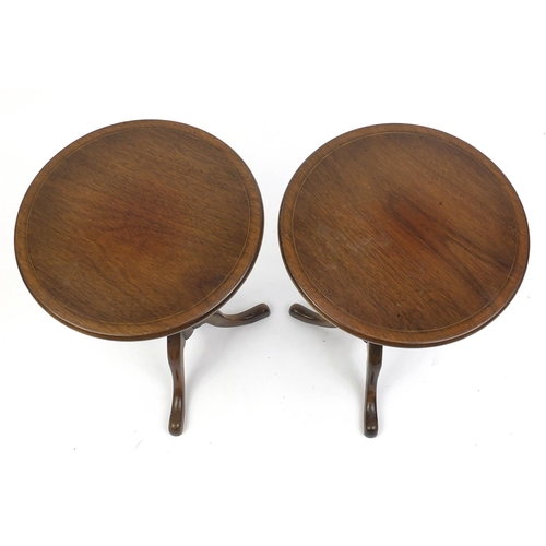 85 - Pair of circular line inlaid mahogany occasional tables, 53cm high x 35cm in diameter