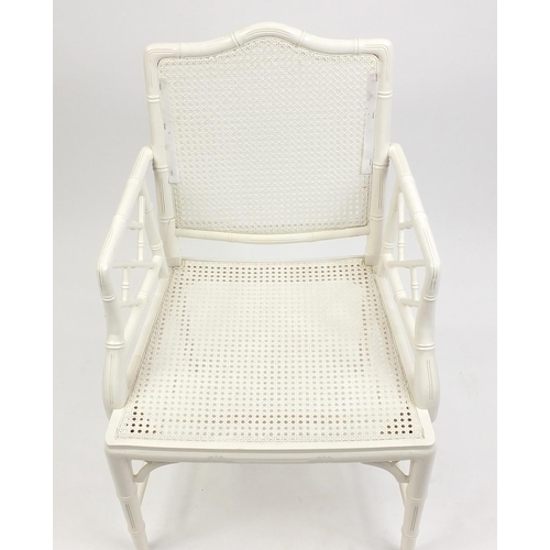 64 - Simulated bamboo elbow chair with cane back and seats and removable cushions