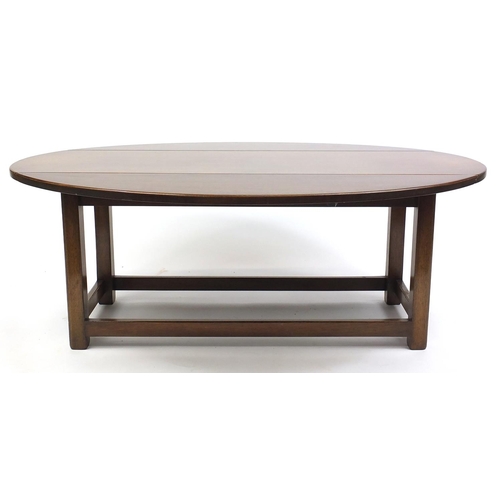 15 - Mahogany drop leaf coffee table in the form of a Georgian wake table, 48cm x 130cm