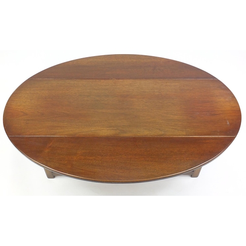 15 - Mahogany drop leaf coffee table in the form of a Georgian wake table, 48cm x 130cm