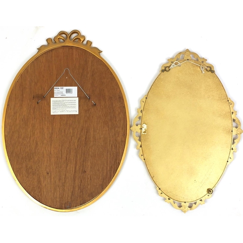 72 - Two oval gilt framed mirrors with bevelled edge, the largest 70cm x 50cm