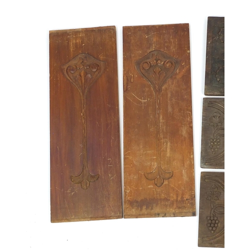 89 - Group of carved wood panels including fielded examples, the largest 61cm in length