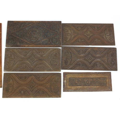 89 - Group of carved wood panels including fielded examples, the largest 61cm in length