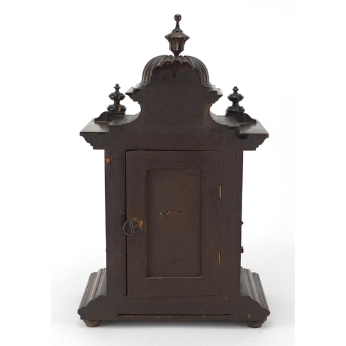 104 - American walnut cased mantel clock, 42cm high