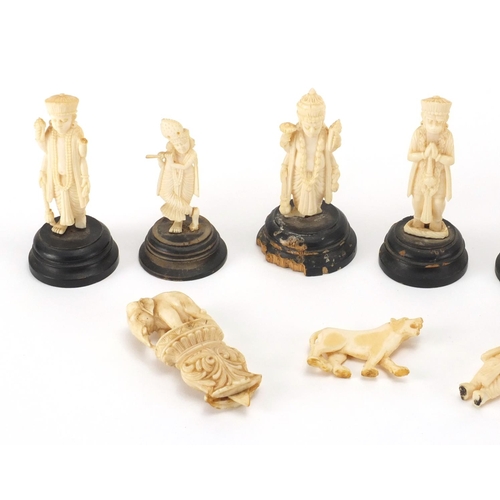 102 - Indian carved ivory figures and animals, some on ebonised wood bases including a finely carved eleph... 