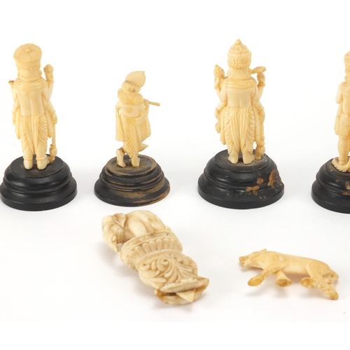 102 - Indian carved ivory figures and animals, some on ebonised wood bases including a finely carved eleph... 