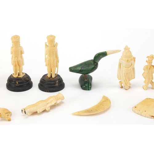 102 - Indian carved ivory figures and animals, some on ebonised wood bases including a finely carved eleph... 