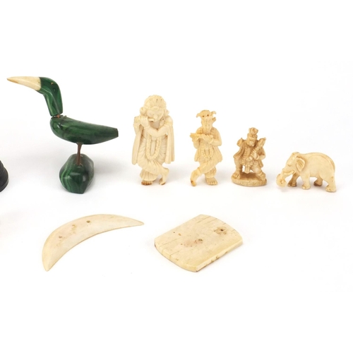 102 - Indian carved ivory figures and animals, some on ebonised wood bases including a finely carved eleph... 