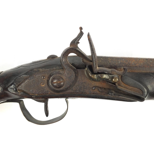 349 - Antique Indian flintlock Blunderbuss with leather powder flask, the barrel with silver inlay and imp... 