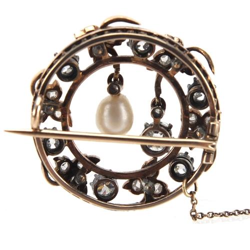 795 - Antique gold pin brooch set with old cut diamonds and a pearl, 2.7cm in diameter, approximate weight... 