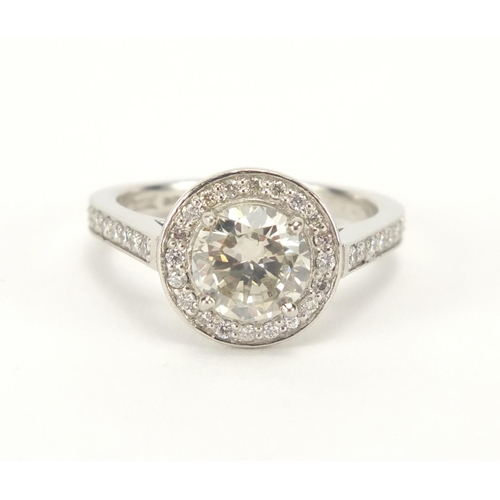 810 - Platinum and diamond solitaire halo ring, size M, approximate weight 6.7g