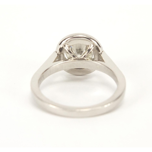 810 - Platinum and diamond solitaire halo ring, size M, approximate weight 6.7g