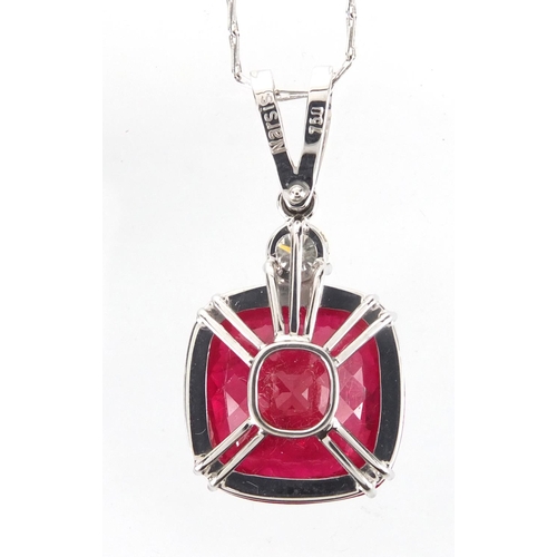 821 - 18ct white gold ruby and diamond pendant on a 18ct white gold necklace, the pendant 3.5cm in length,... 