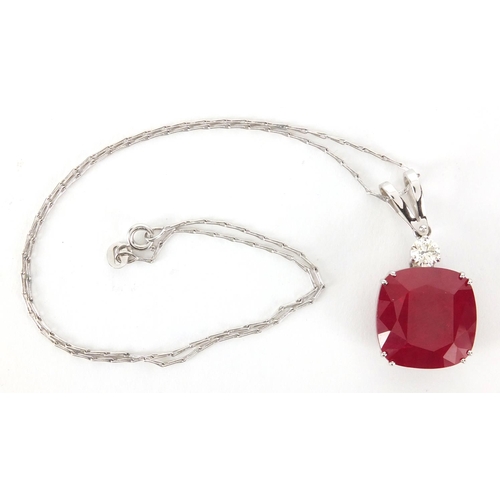 821 - 18ct white gold ruby and diamond pendant on a 18ct white gold necklace, the pendant 3.5cm in length,... 