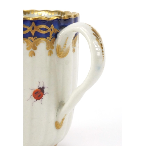 599 - 19th Century Royal Worcester fluted porcelain cup, the centre hand painted with a panel of a bridge ... 