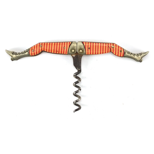 74 - Novelty folding pocket corkscrew in the form of a pair of ladies legs with striped celluloid stockin... 