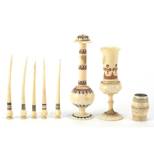 104 - Antique and later ivory and bone objects including a rose water dropper and a fluted vase, decorated... 