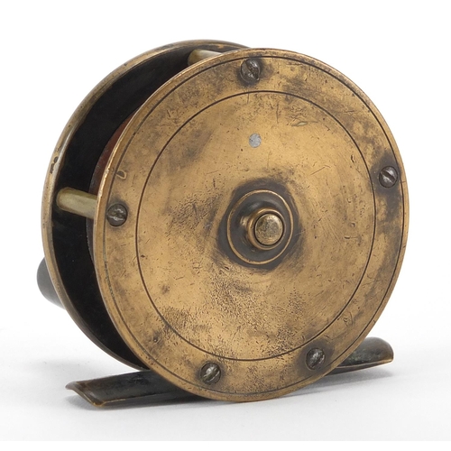 136 - Victorian brass fishing reel by P D Malloch maker of Perth, with leather case, 6.5cm in diameter