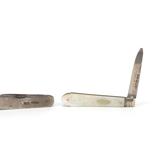 60 - Two silver flanked folding pocket knifes, together with a Victorian Mother of pearl flanked silver b... 