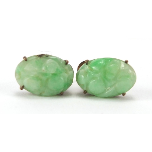 489 - Chinese green jade and unmarked gold suite comprising a pair of earrings, carved with flowers and a ... 