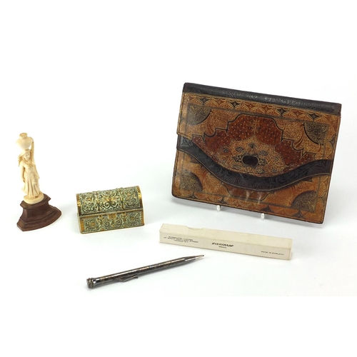 42 - Miscellaneous objects including a leather clutch bag, carved ivory figure and a Victorian dome toppe... 