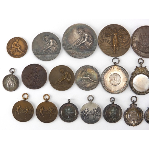 316 - Military interest sporting jewels and medallions, some silver including The Army Rifle Association, ... 