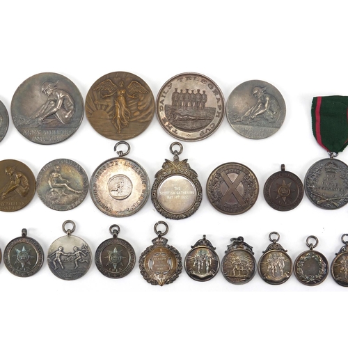 316 - Military interest sporting jewels and medallions, some silver including The Army Rifle Association, ... 