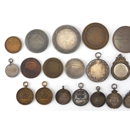 316 - Military interest sporting jewels and medallions, some silver including The Army Rifle Association, ... 