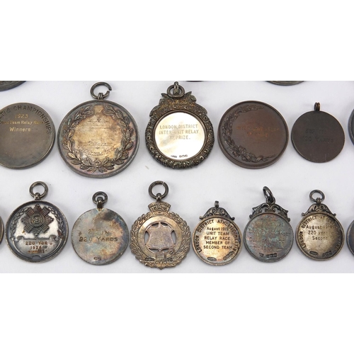 316 - Military interest sporting jewels and medallions, some silver including The Army Rifle Association, ... 