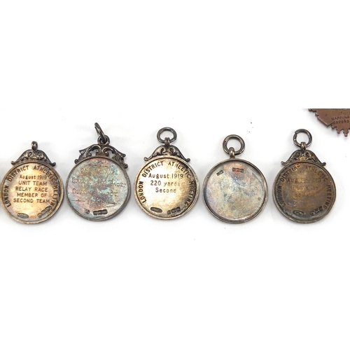 316 - Military interest sporting jewels and medallions, some silver including The Army Rifle Association, ... 